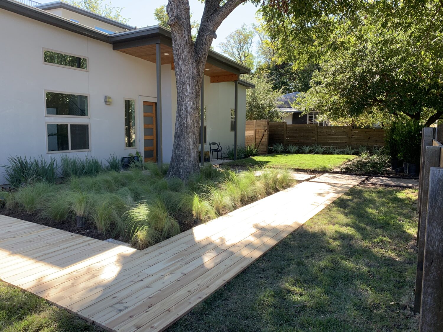 Austin landscape and design - cedar boarwalk and grama grass