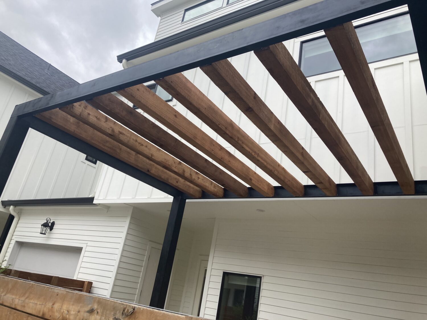 Austin landscape and design - steel paragola with cedar beams