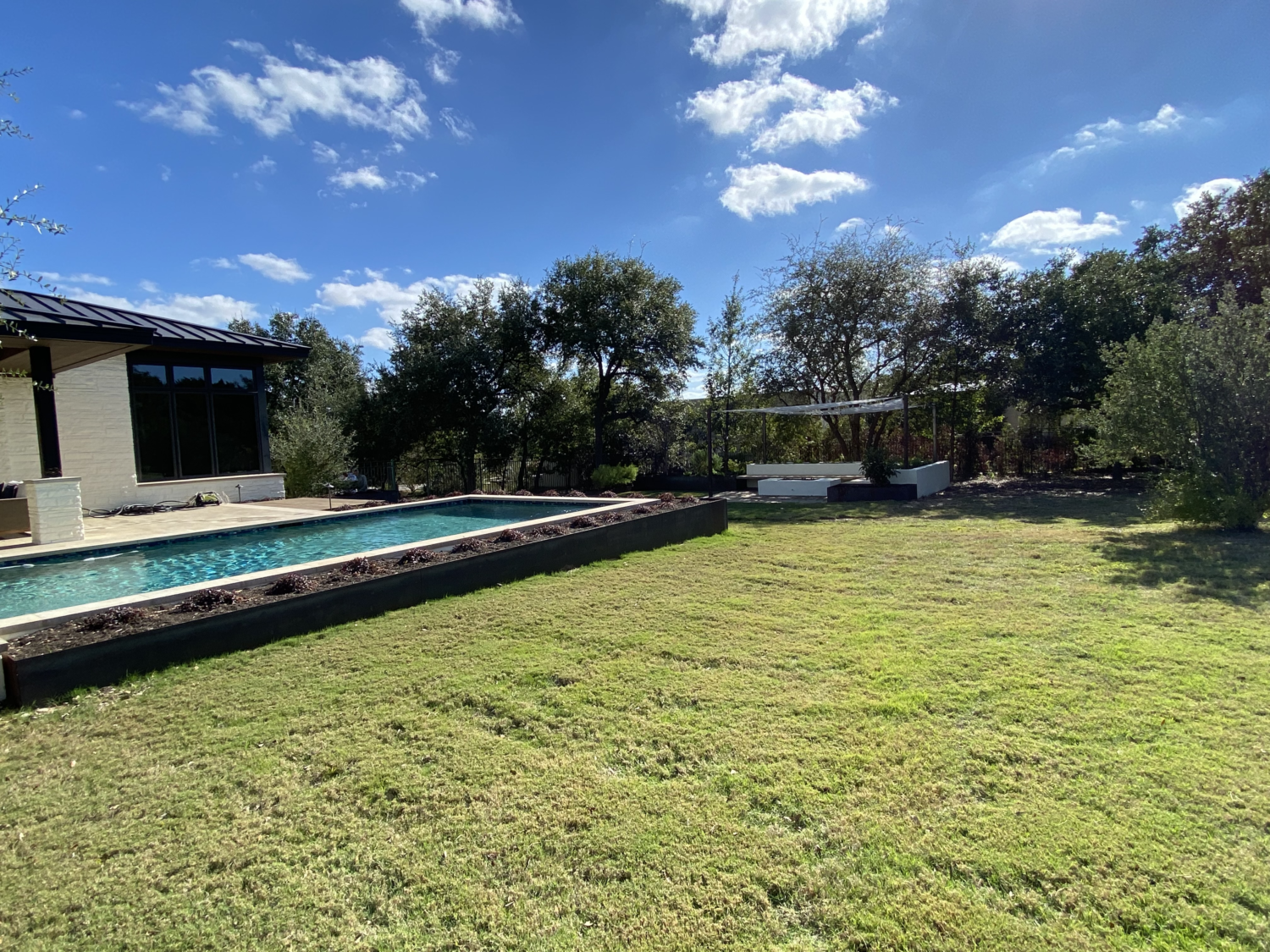 Austin landscape and design - planters wrap, upper pool patio